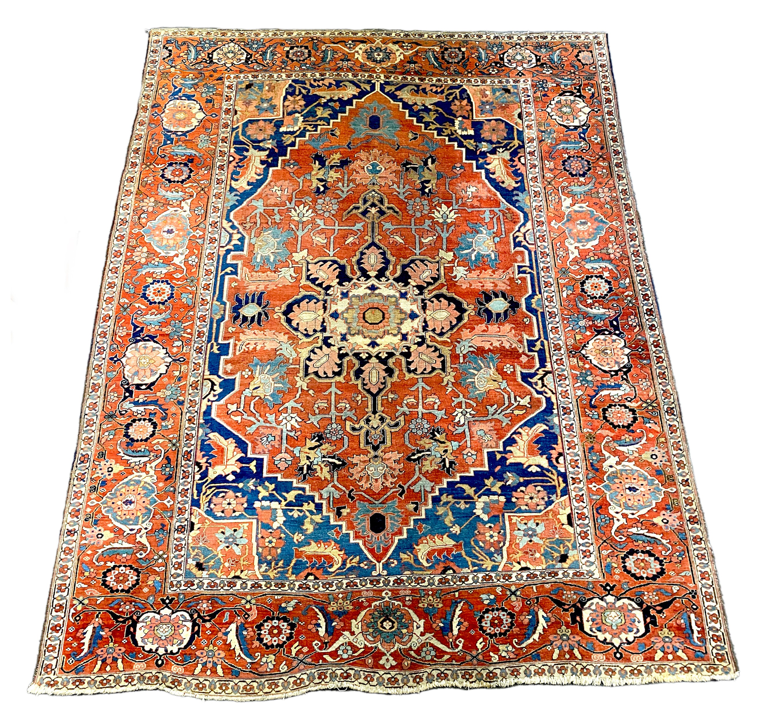 An antique Heriz brick red ground carpet, 370cm x 290cm